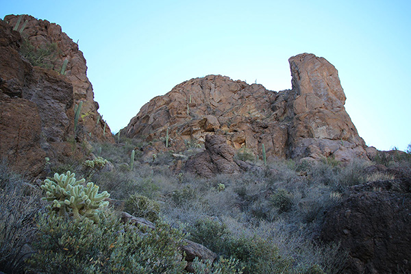 The upper west gully of Cat Mountain leads beneath the summit cliffs to a narrow saddle on the left.
