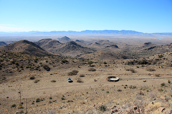 Descending towards my Jeep and the empty spring-fed water tank. The Winchester Mountains lie in the distance.