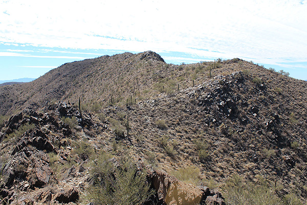 The true summit finally peeks above the ridge ahead