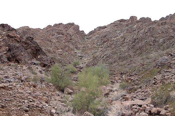 The ascent gully leads directly up the slope. I found firm footing in the bottom of the gully.