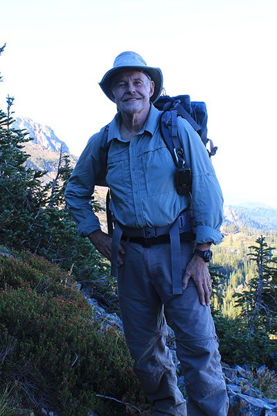 Paul climbing talus slopes on the west face of Red Mountain