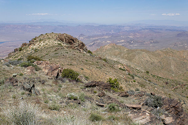 As we descend high on the north ridge our access road is visible just right of center
