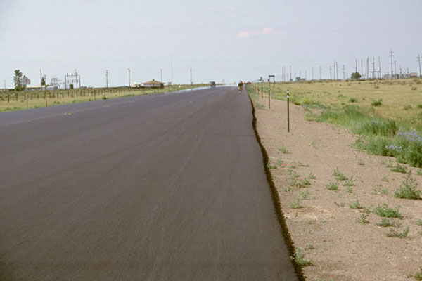 Smooth pavement in strong headwind as I ride towards Alamosa