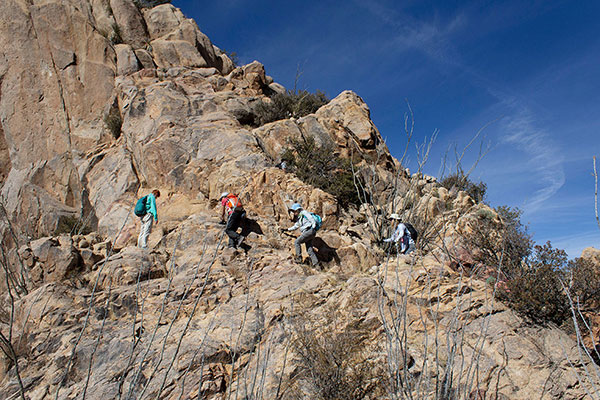 Climbing ledges low on the route