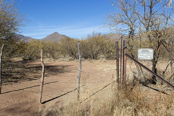 This locked gate is just a few feet off the highway, but foot traffic is allowed beyond