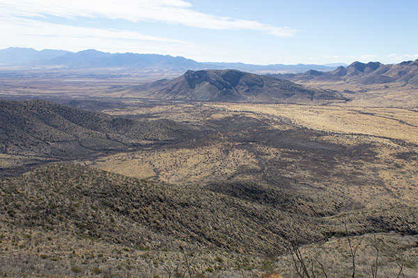 We descend to the valley and return to my Jeep below the unnamed peak ahead