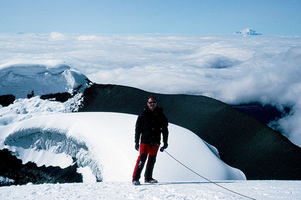 Paul on the Cotopaxi summit with Chimborazo in the distance
