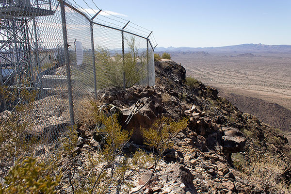 The Childs Mountain high point (summit) squeezed against the fence