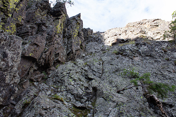 The wall at the end of the gully steepens near the hanging rope