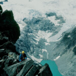 Bill following below the summit of Forbidden Peak